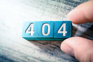 Error Code 404 On Blue Wooden Blocks On A Table, Arranged By Hand