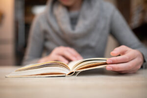 Girl reading a book at home