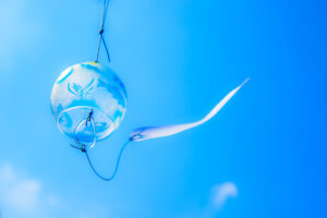 Japanese wind chime against blue sky